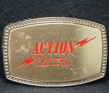 XB01156 VINTAGE 1970s ACTION ELECTRIC POWER  ENERGY ADVERTISEMENT BELT BUCKLE