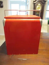 Red metal picnic beverage  cooler with bottle opener and handle plastic liner