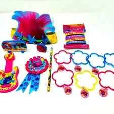 Vibrant Trolls-themed party favor set with a mix of pink, blue, and yellow items