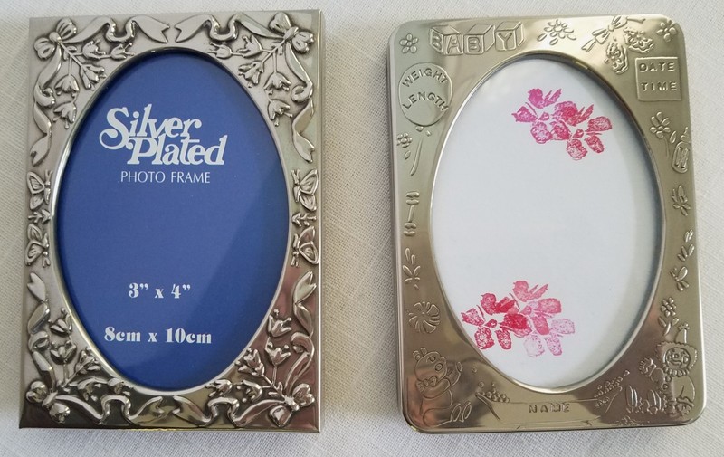 Lot of 2 Child/Baby Picture Frames, one is silver, other is silver plated