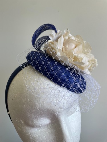Blue button base fascinator with blue sinamay loops, cream flower and netting - Picture 5 of 5