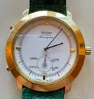 Seiko quartz chronograph gold toned rim, green leather band vintage