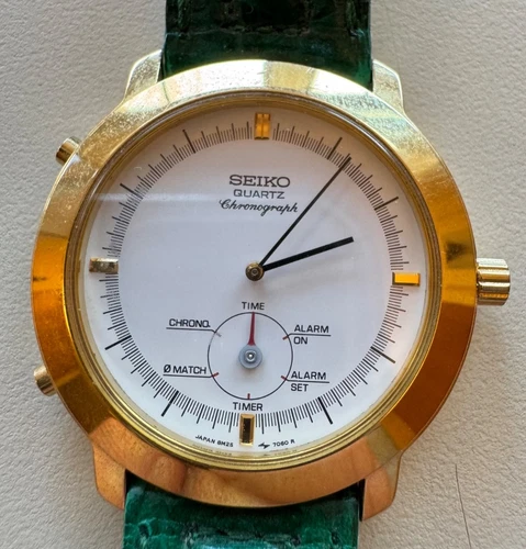 Seiko quartz chronograph gold toned rim, green leather band vintage