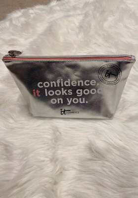 NWOT. IT Cosmetics Silver Metallic ColoredCosmetic Bag with pink inside lining.