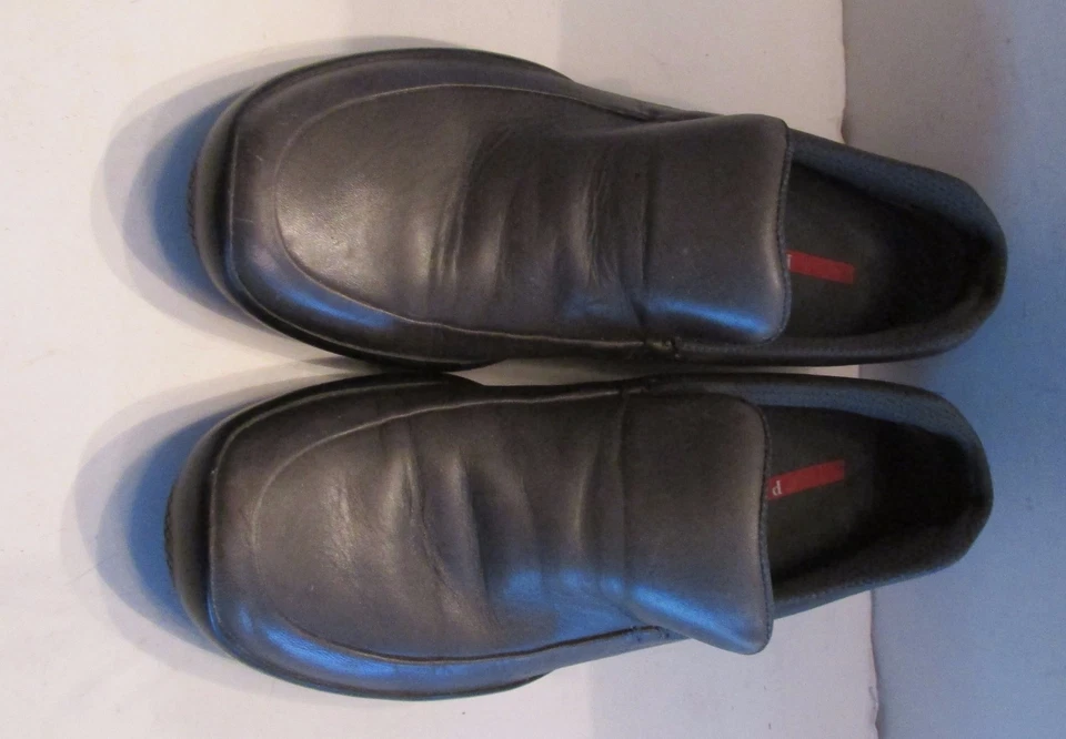 Prada Men's Leather Clogs Slip On Loafers Dark Gray Size 6 Red Stripe on Heel | eBay Prada Men's Leather Clogs Slip On Loafers Dark Gray Size 6 Red Stripe on Heel | eBay