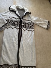 Cowichan or Mary Maxim-style cardigan, a bulky, hand-knit sweater 1950s and 60s.