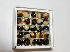 BOX SET OF 25 JABO  U V REACTIVE BURMESE WITH AVENTURINE  MARBLES. $40.00  Box 