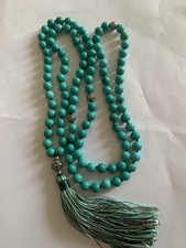 turquoise mala, which is a string of 108 beads