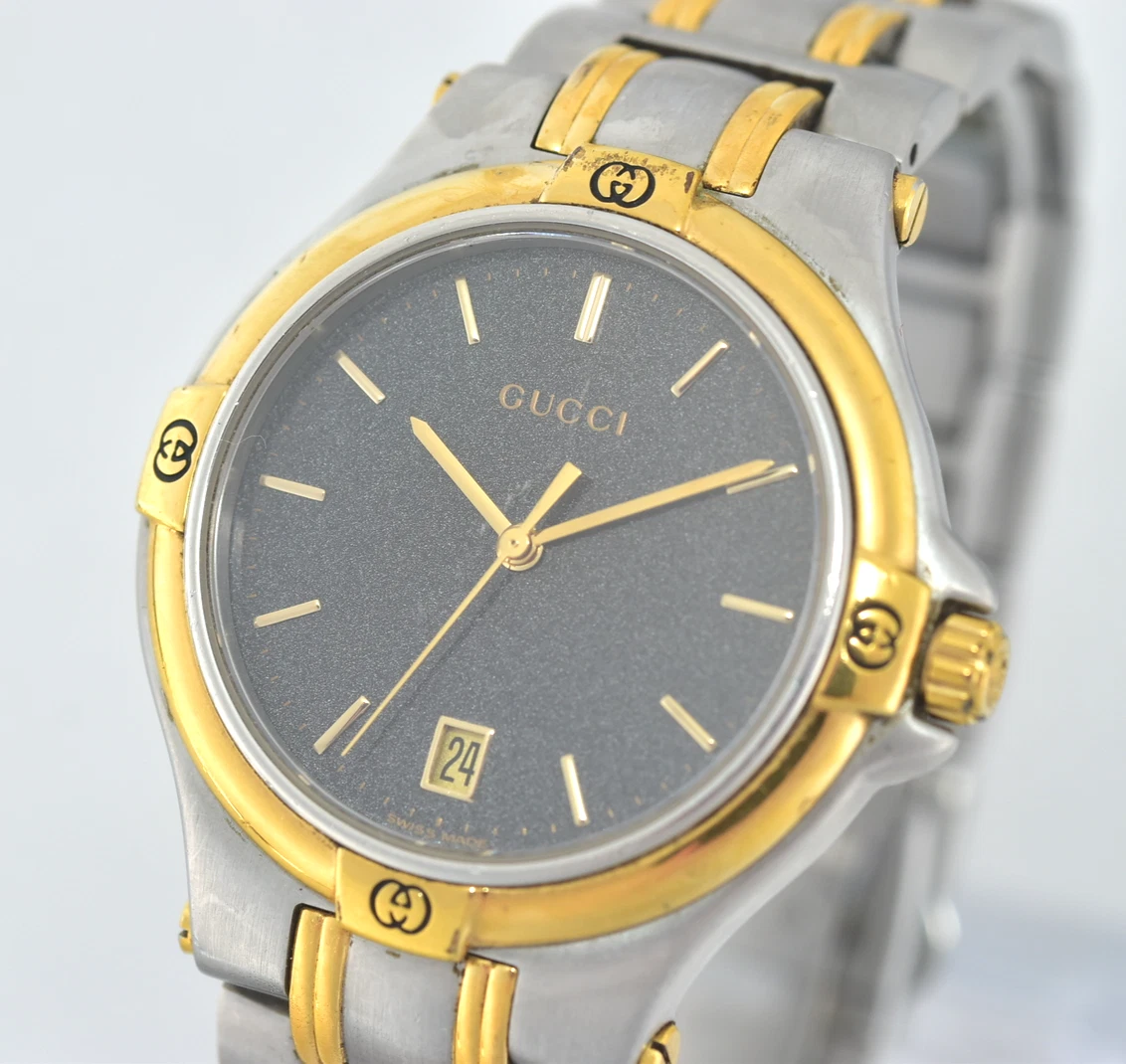 Montre vintage homme GUCCI 9040M cadran noir date QZ fabrication suisse pile neuve