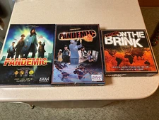 Lot Of 2 Pandemic Board Games & On The Brink Expansion Game