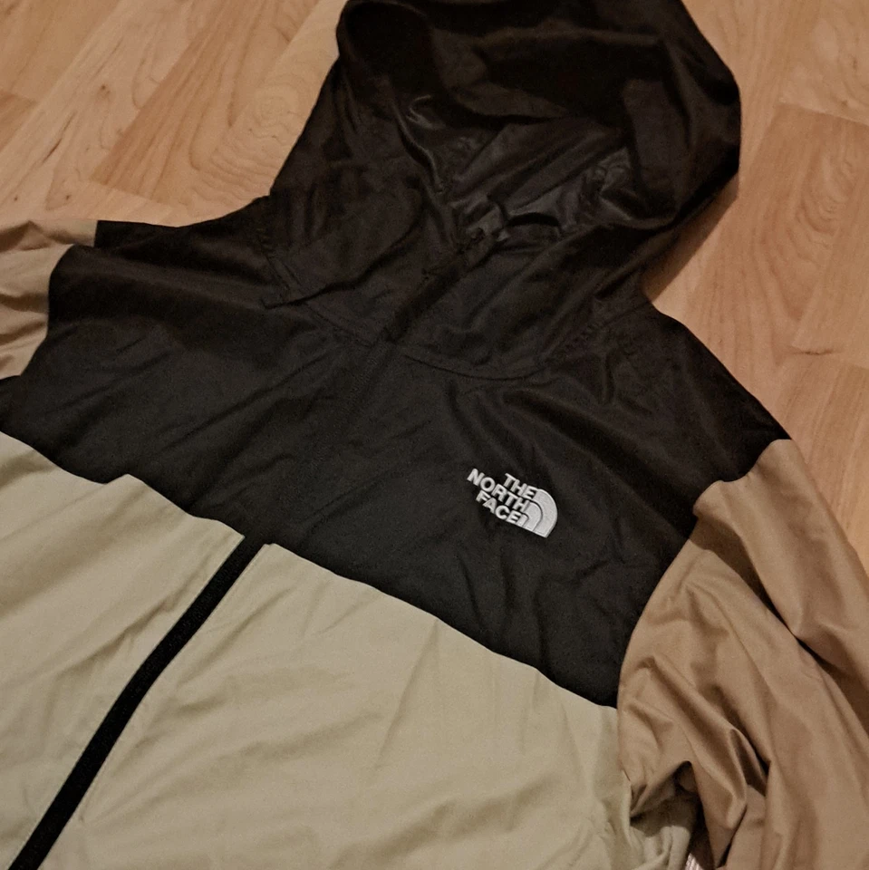 The North Face Veste coupe-vent à capuche homme S noir/beige zippée NF0A82R9 - Photo 2/4