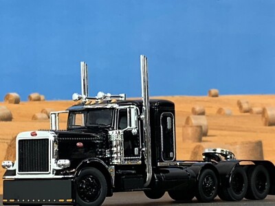 1/64 DCP BLACK PETERBILT 389 TRI AXLE W/ 36