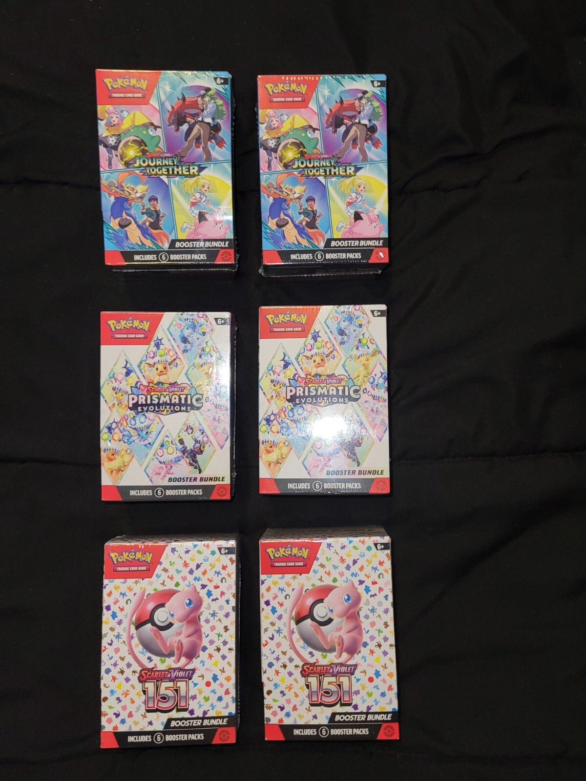 6 booster boxes of assorted pokemon cards