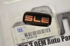 1997-2001 GMC Sierra Body Side Chrome/Black/Red SLE  EMBLEM new OEM 15036134