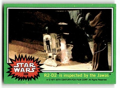 1977 Topps Star Wars #228 R2-D2 is inspected by the Jawas
