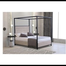Black four poster double bed with plush velvet cream buttoned headboard