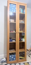 “Tall Glass Display Cabinet Light Oak Effect Double Door Shelving”