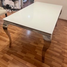 “Next” glass dining room table, can seat up to 6. Smoke freeVery good condition 