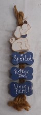 A Spoiled Rotten Dog lives here Cute Dog Sign 2-1/2" W x 12" Long Wood Hanging