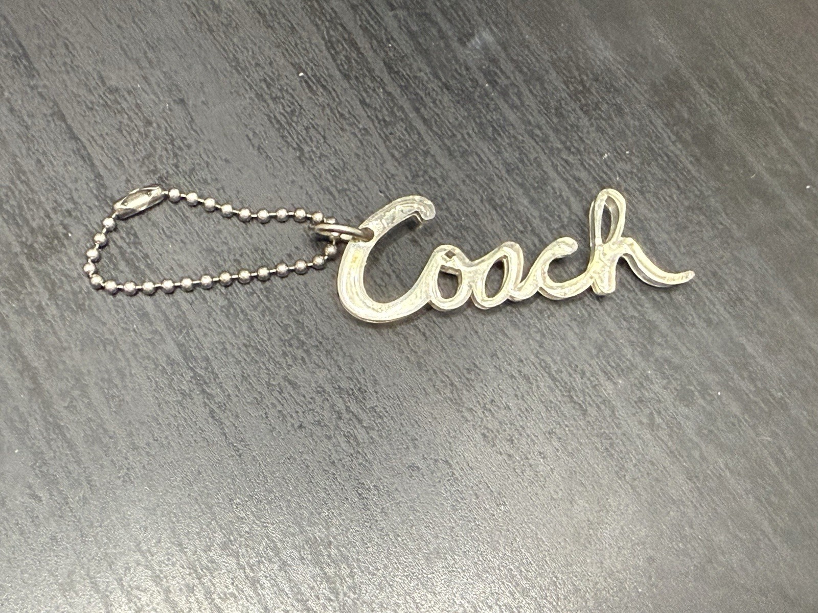 COACH Silver Acrylic Script Signature Hang Tag Purse … - Gem
