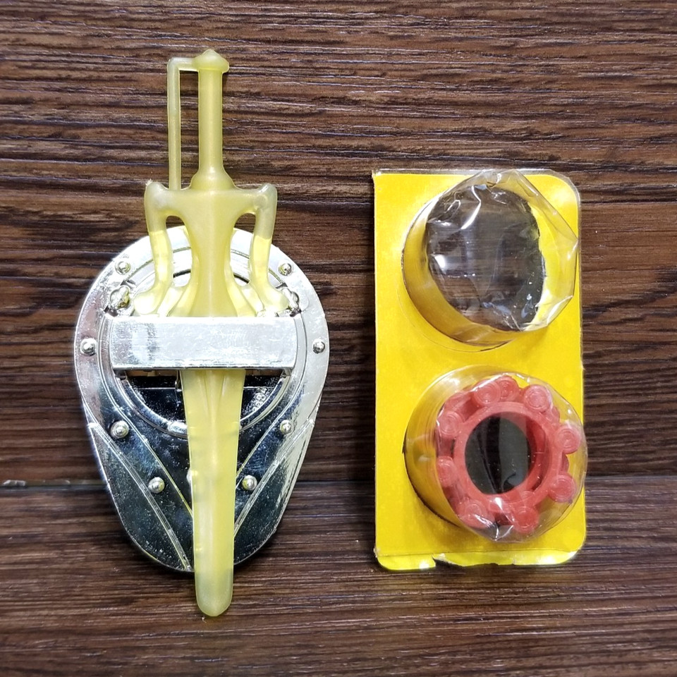 1985 Thunder Punch He-Man accessories lot — the spring-loaded punch gimmick was peak MOTU engineering, and finding the accessories is half the collector's battle.