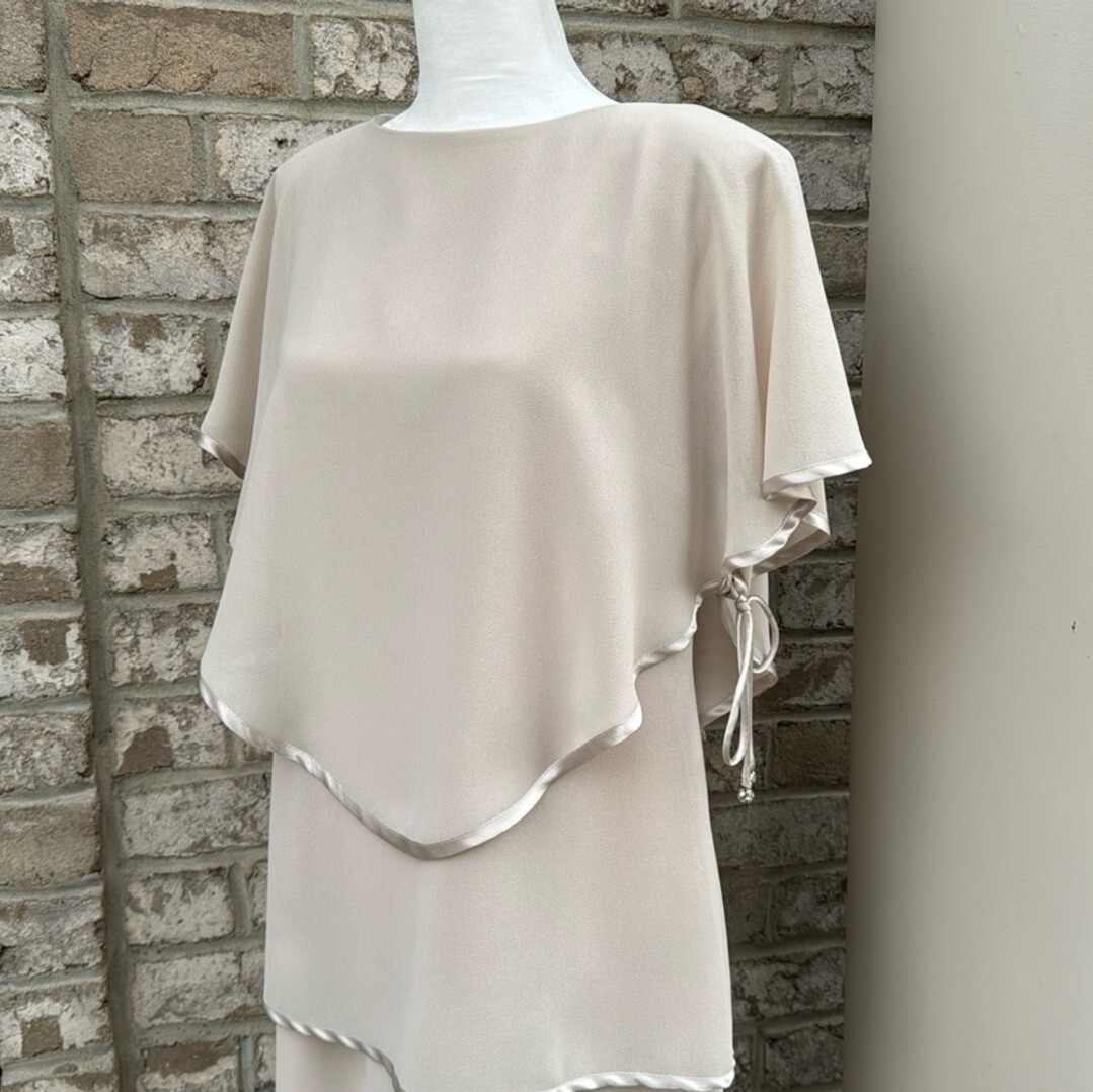 cream cocktail dress for wedding color gown | Flowy tulle wedding leading to a fitted waistband that defines your figure Ivory Cocktail Dresses | Windsor