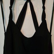 Black, floor length evening gown. Size 12. Tie straps and back. Worn once