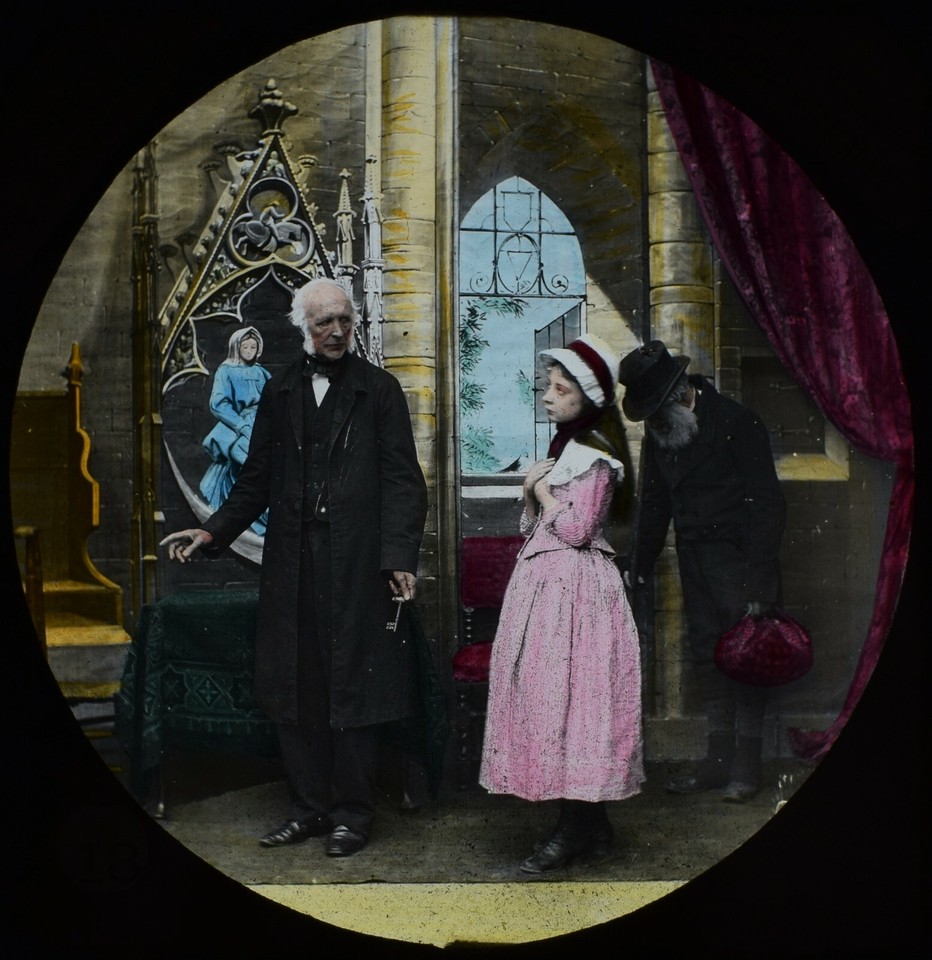 A genuine 1884 magic lantern slide — the Victorian equivalent of a film still — depicting a scene from Dickens' The Old Curiosity Shop, an extraordinary piece of pre-cinema visual history you can actually hold.