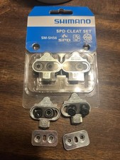 2 jeux de crampons Shimano Silver SM-SH56 SPD multi-release L. 1 set neuf dans son emballage—1 set ouvert
