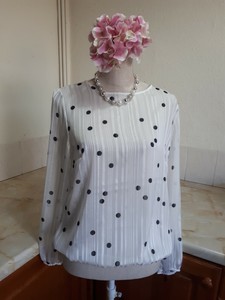white blouse with black spots
