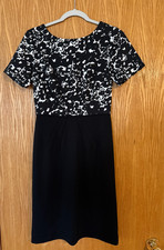 Women’s Size 2 Tahari Dress  Black W/pattern Top short sleeves.