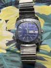 vintage Timex Marlin wristwatch features a TV-shaped case and a blue dial.