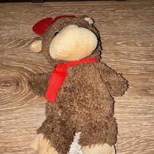This item is a plush moose toy, commonly sold as a Christmas-themed collectible
