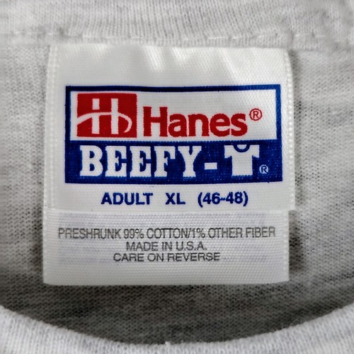 Gray vintage Hanes Beefy-T personnel temps T-shirt XL with white label, blue “Hanes Beefy-T” logo, and red “Made in U.S.A.” text.