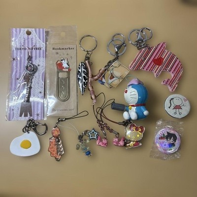 11 character key chain sets, 1 bookmark, 2 tin badges