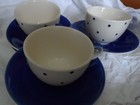 Whittard of Chelsea Tea Clipper three blue spot tea cups and four saucers.