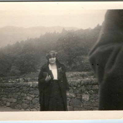 c1920s Cute Lady Stone Wall Snapshot Photo Scotland Hills Mountain Plaid Cap Vtg