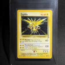 Zapdos 20/130 Holo Rare + Cosmos SWIRL Set Base 2 2000 Carte Pokemon TCG WOTC QUASI NUOVE+