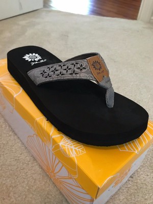 yellow box gray flip flops