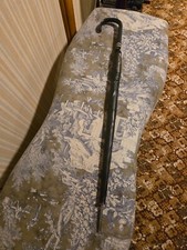 antique black umbrella in a leather zip case