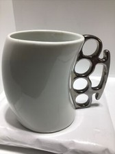 KNOCKOUT FRED COFFEE MUG. EMBOSSED KNUCKLE DUSTER HANDLE MUG. Art Deco Mug. B217