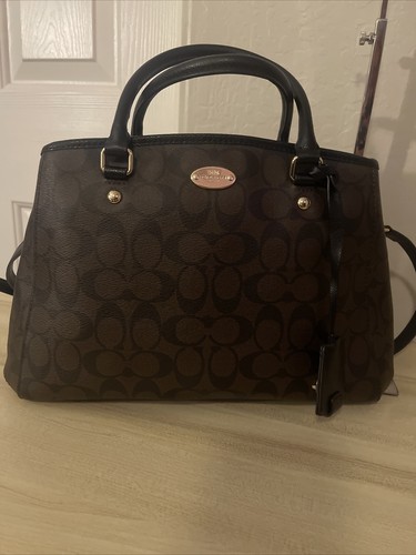 can coach purses be dry cleaned