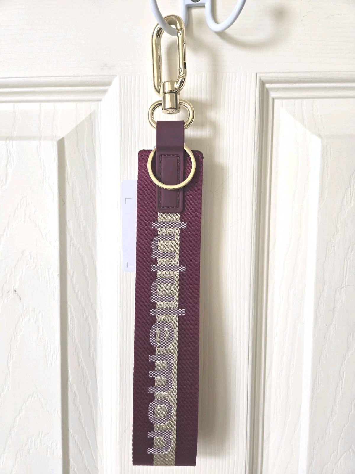 Lululemon Never Lost Keychain NWT in Burgundy Gold Bone with Gold Hardware