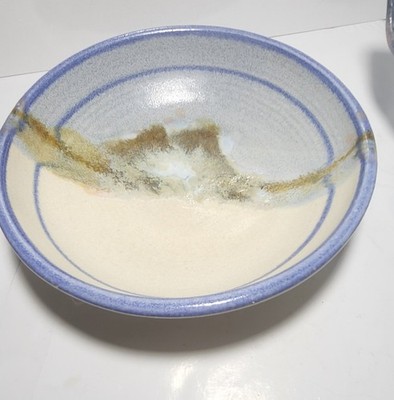 Handthrown stoneware studio pottery bowl with a mountain landscape glaze