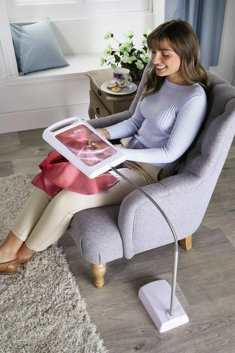 Reading light with store magnifying glass