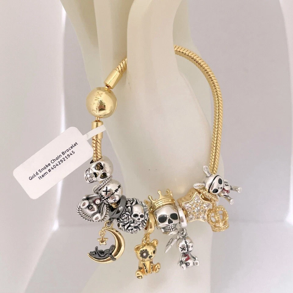Brazalete de cadena de serpiente de oro amarillo Linx con dijes temáticos de calavera Foto 2 de 4