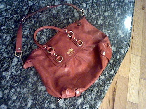 shiny red coach purse