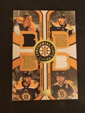 2023-24 Boston Bruins Centennial Cloth Quad Relics Bucyk/Marchand/Oates/Pasta