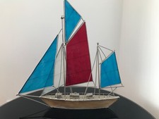 VINTAGE METAL SAILING BOAT ORNAMENT WITH RED, WHITE & BLUE STAINED GLASS SAILS
