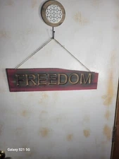 Red Rustic wood FREEDOM sign with torched lettering and finished with Matte 